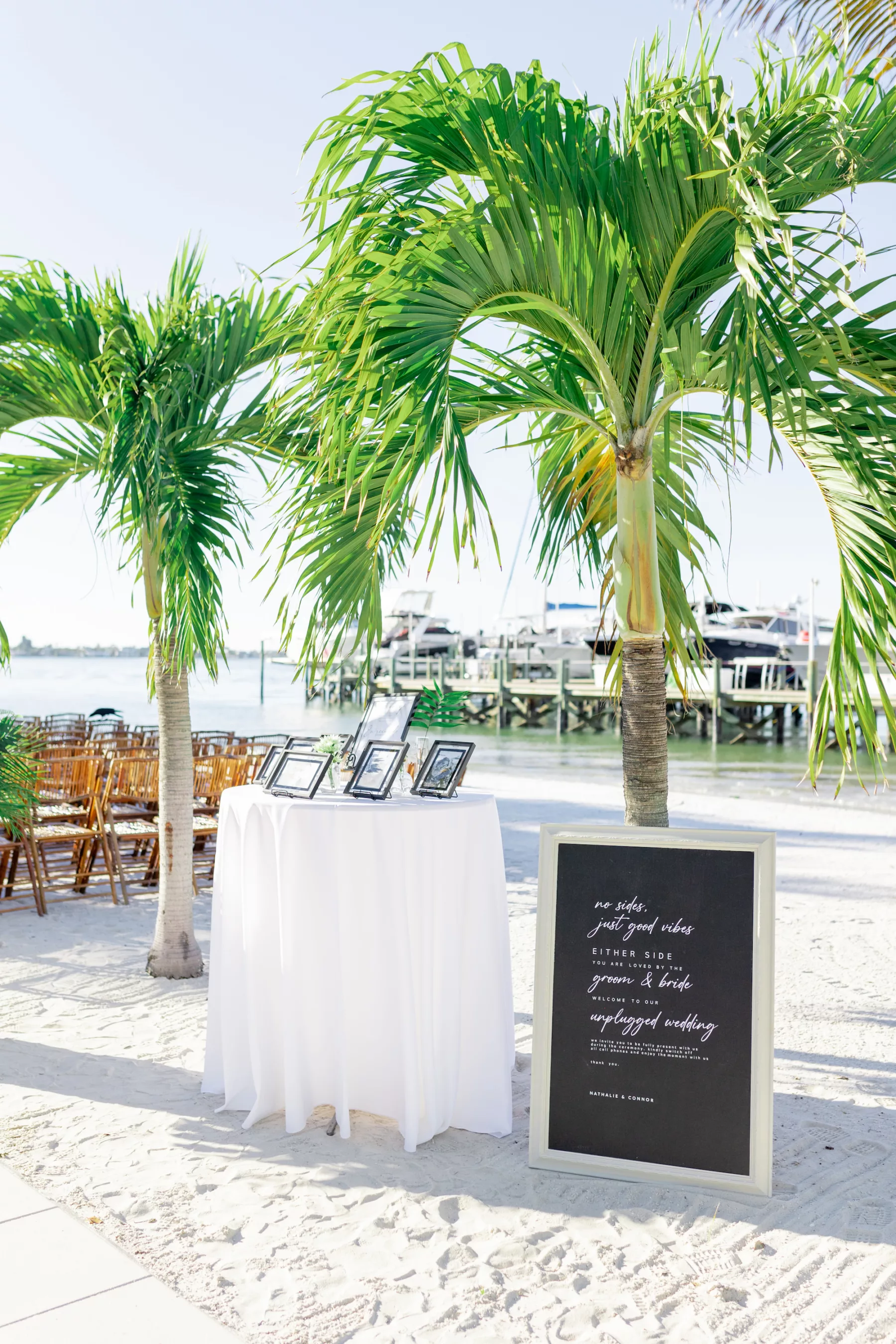 Modern Tropical Black and White Private St Pete Beach Wedding Ceremony Inspiration | In Memory Table Ideas | No Sides, Just Good Vibes Unplugged Wedding Sign