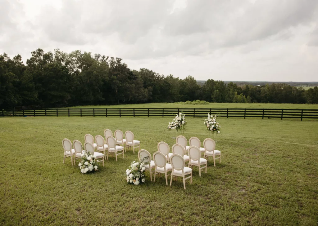 Elegant Outdoor European Inspired Wedding Ceremony Decor Ideas | White Round King Louis Chair Inspiration | Tampa Bay Event Venue La Hacienda on Snow Hill