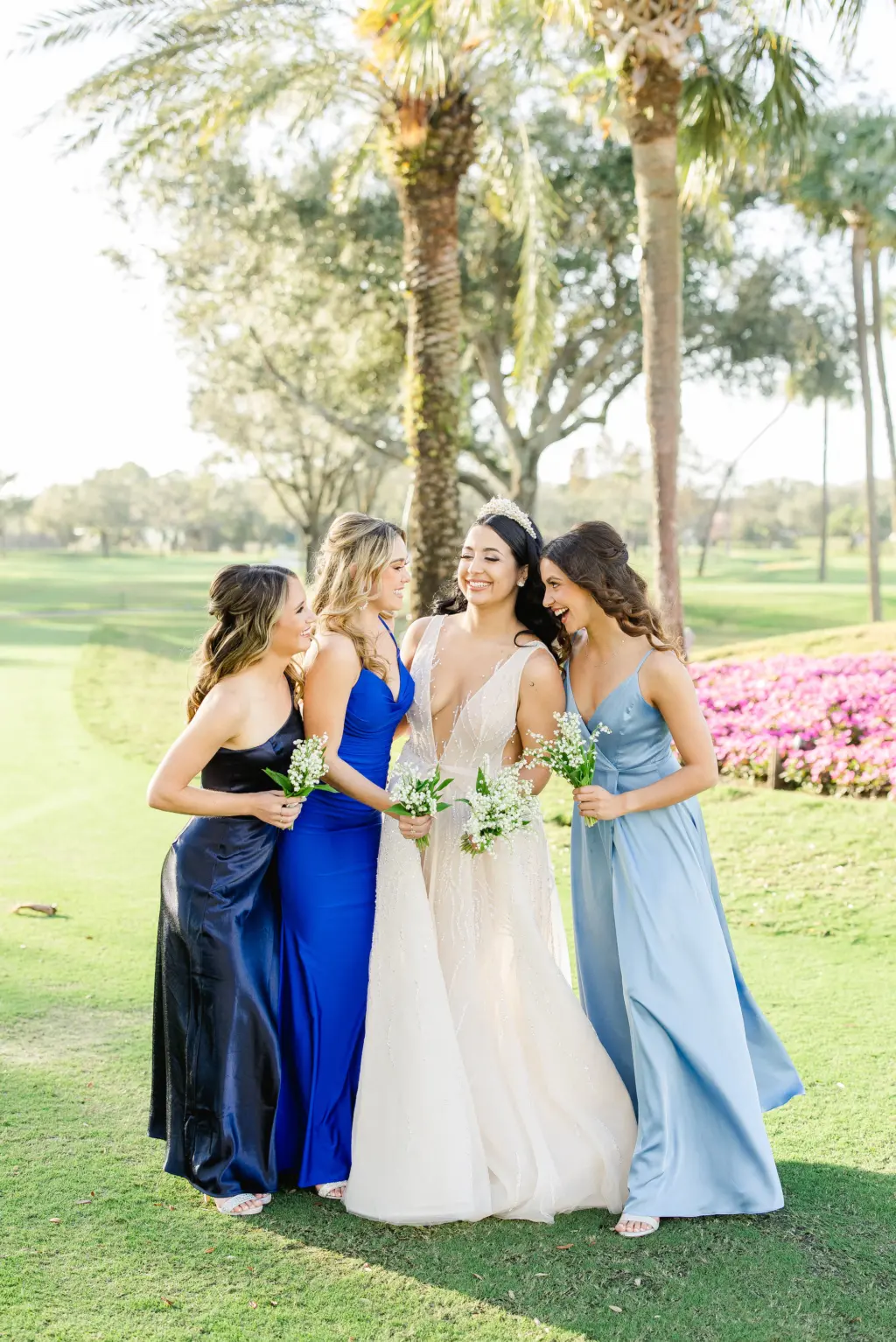 Mismatched Icy Light Blue, Cobalt, and Navy Bridesmaids Dresses | White Plunging Deep V Neckline A-Line Tulle and Sequin Eisen Stein Wedding Dress Ideas