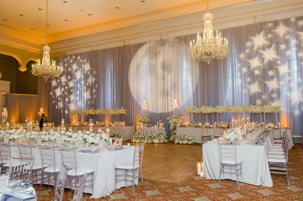Whimsical White Starry Night Winter Wonderland Wedding Reception Inspiration | Long Feasting Tables with Floating Candles, and Rose Table Top Flower Arrangement Ideas | Clear Acrylic Chiavari Chairs | South Tampa Event Venue Palma Ceia Golf and Country Club | Tampa Bay Lighting and DJ Grant Hemond & Associates