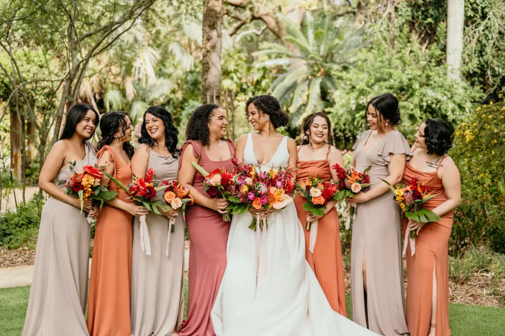 Mismatching Beige Taupe and Burnt Orange Bridesmaids Dresses with Tropical Wedding Bouquets | Tampa Bay Florist Save The Date Florida