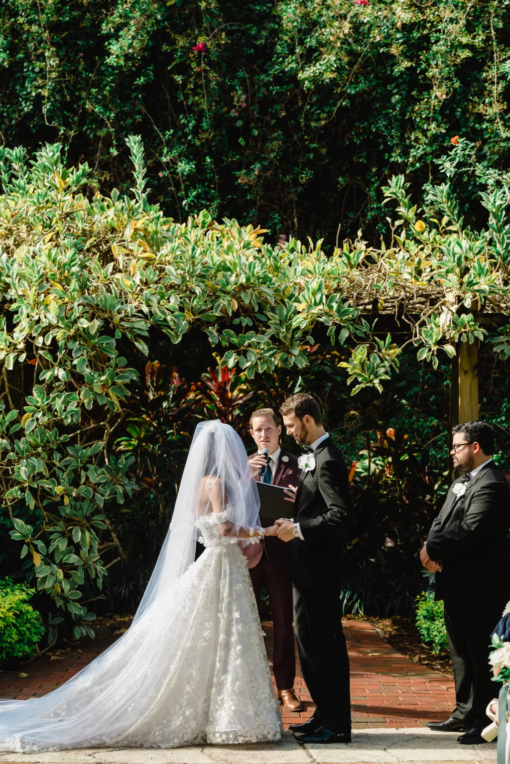 Bride and Groom Vow Exchange Garden Wedding Portrait