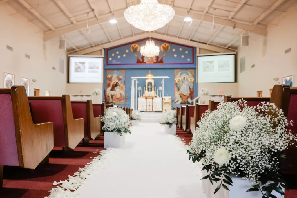 Orthodox Church Wedding Ceremony Ideas | White Aisle Runner with Modern Planter with White Baby's Breath, Chrisanthemum, and Greenery Decor Inspiration | Tampa Event Venue St. Athanasius Syriac Orthodox Church