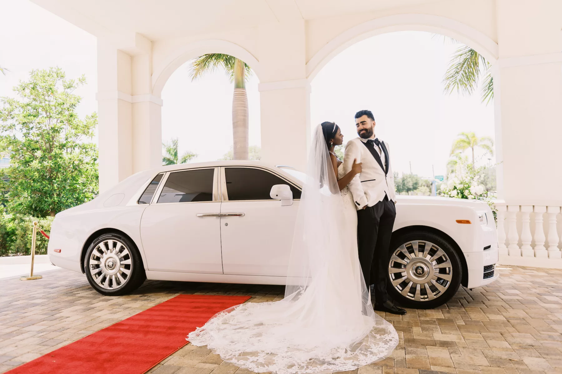 Bride and Groom with White Rolls Royce Wedding Day Getaway Car Inspiration