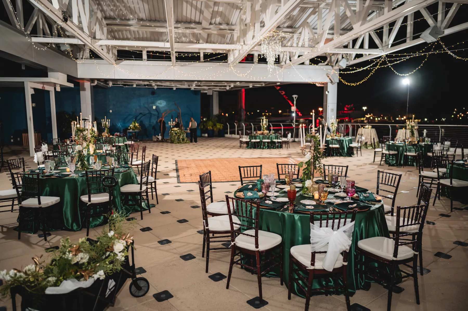 Rooftop Terrace Nautical Emerald Green Wedding Reception Inspiration | Mahogany Chiavari Chairs | Gold Candelabra with White Roses and Greenery | Tampa Bay Outside The Box Event Rentals | Florist Lemon Drops | Venue The Florida Aquarium | Planner Breezin Weddings