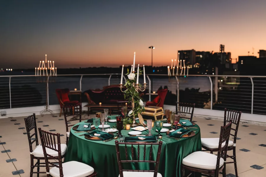 Rooftop Terrace Nautical Emerald Green Wedding Reception Inspiration | Mahogany Chiavari Chairs | Gold Candelabra with White Roses and Greenery | Tampa Bay Outside The Box Event Rentals | Florist Lemon Drops | Venue The Florida Aquarium