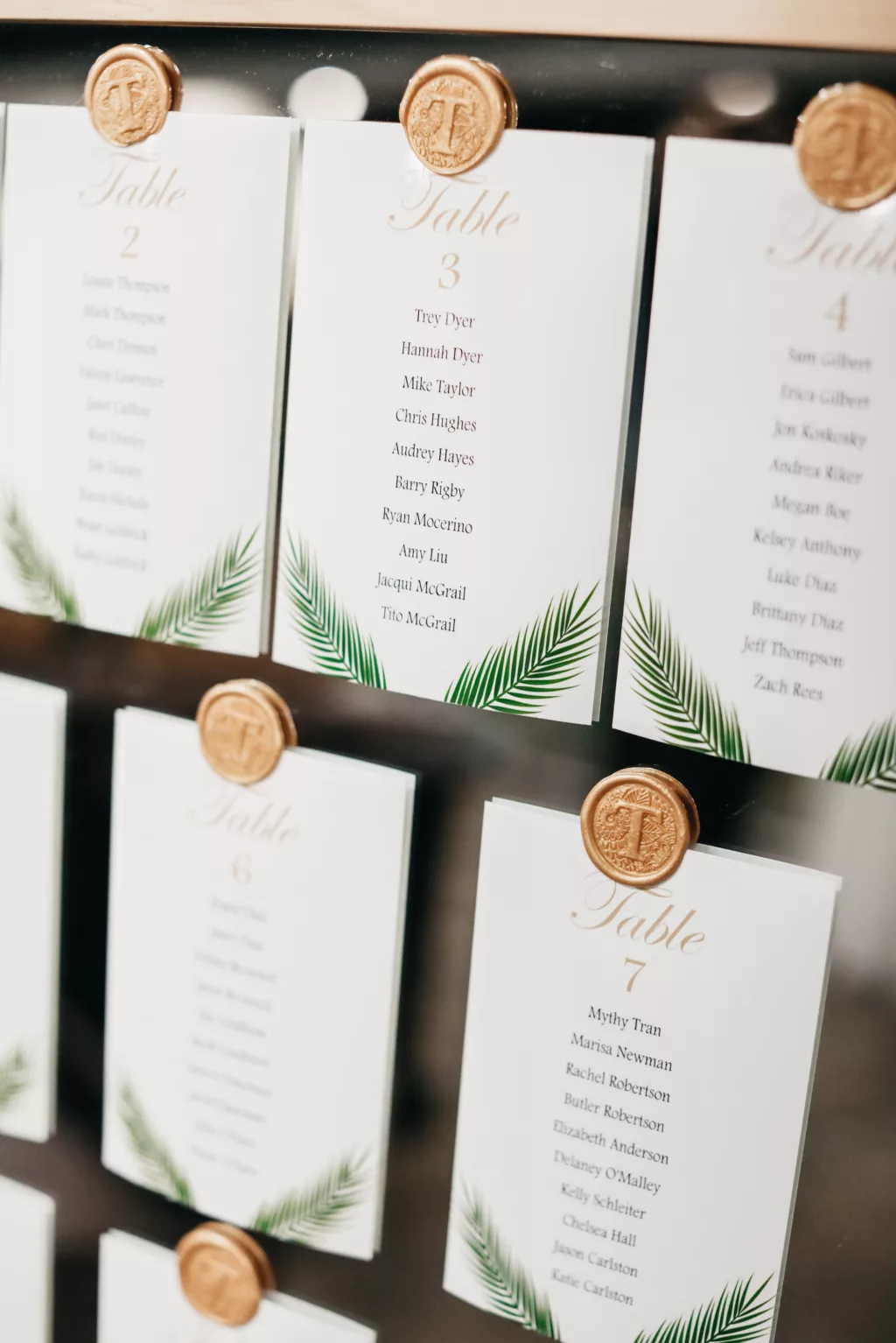 Tropical Seating Chart on Mirror with Gold Monogrammed Seal Wedding Reception Decor Ideas
