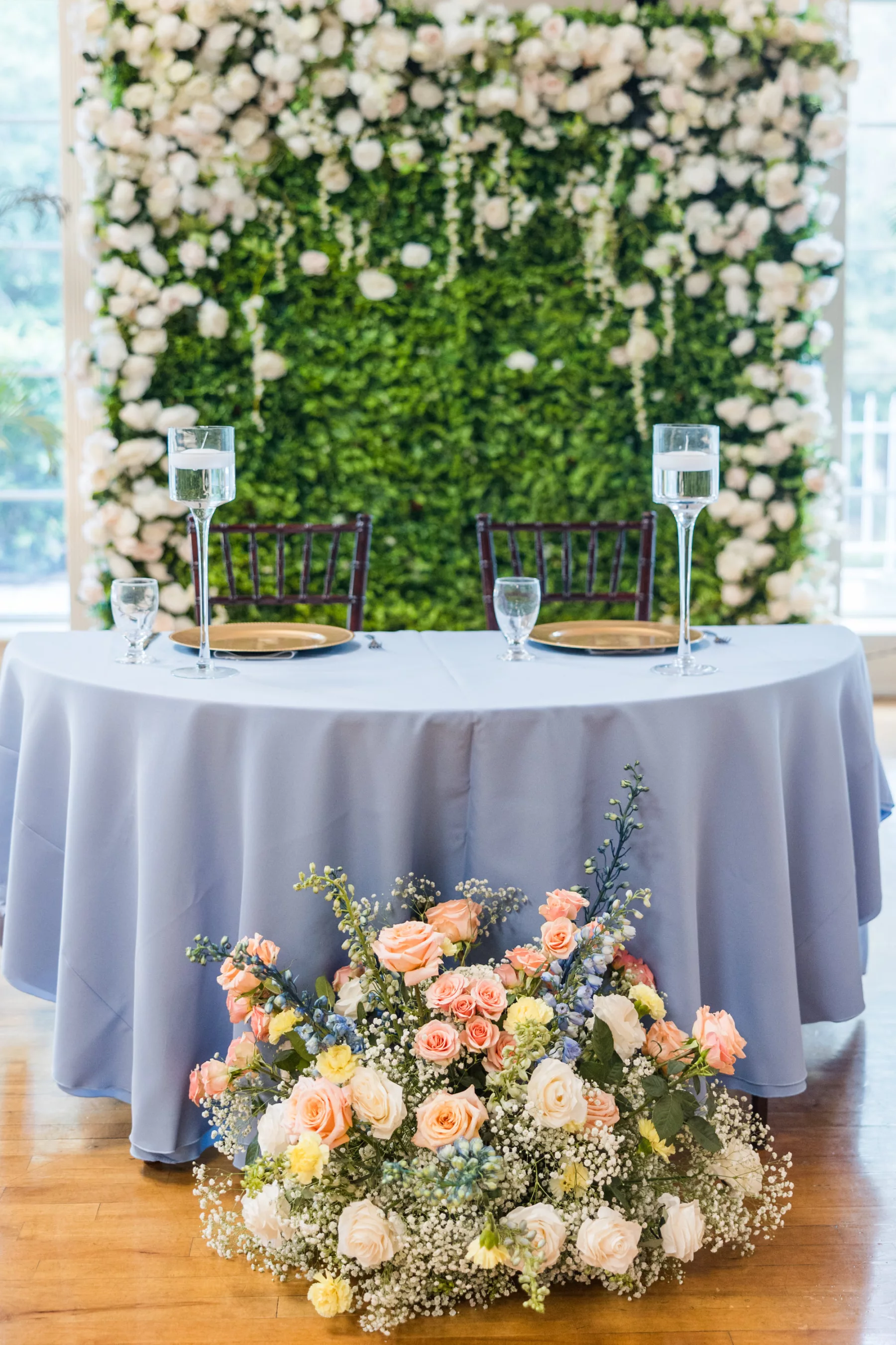 Blue and Peach English Garden Inspired Wedding Reception Sweetheart Table Decor Ideas | Peach Roses, Yellow Carnations, Baby's Breath, Blue Snapdragon Floor Flower Arrangement Inspiration