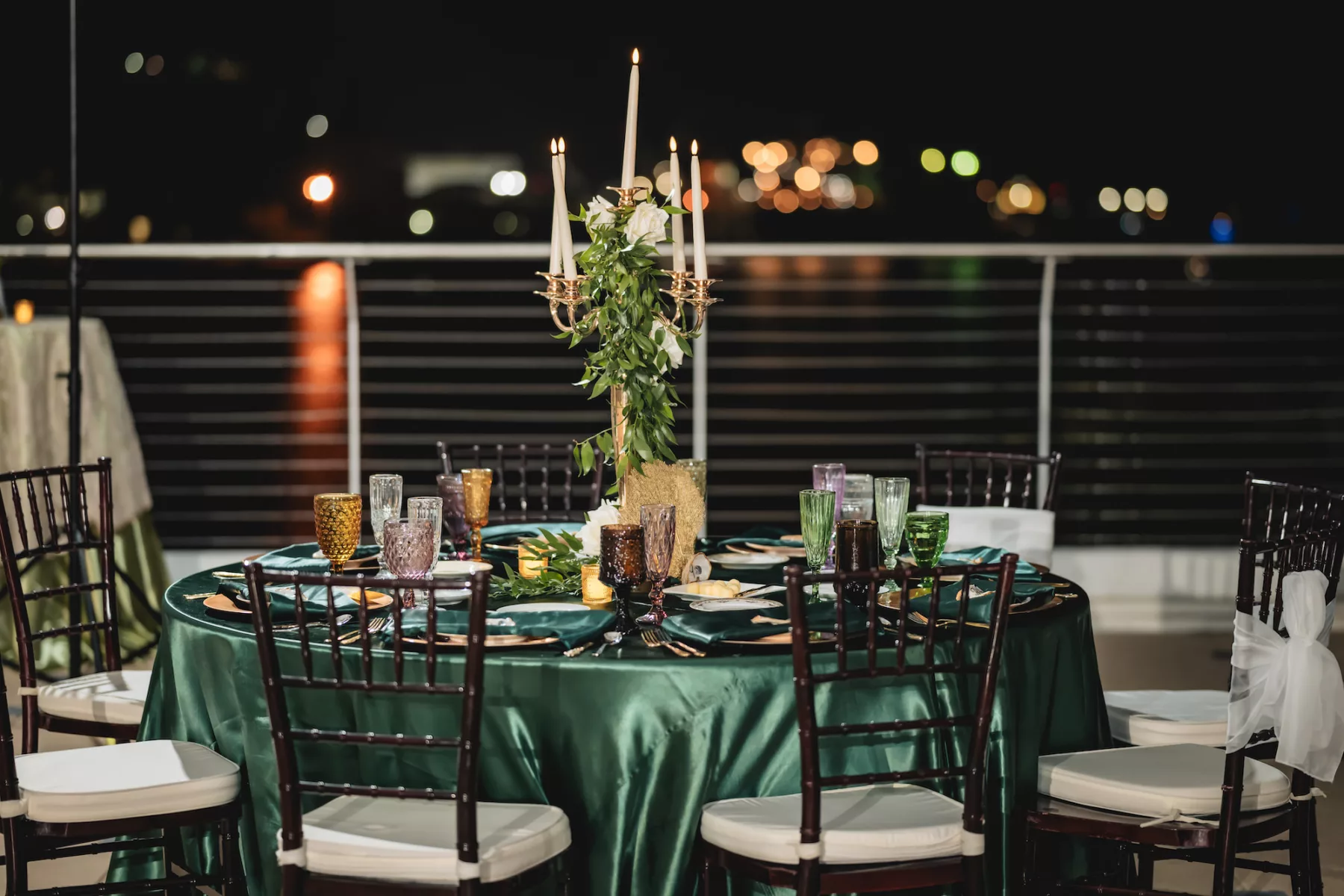 Rooftop Terrace Nautical Emerald Green Wedding Reception Inspiration | Mahogany Chiavari Chairs | Gold Candelabra with White Roses and Greenery | Tampa Bay Outside The Box Event Rentals | Florist Lemon Drops