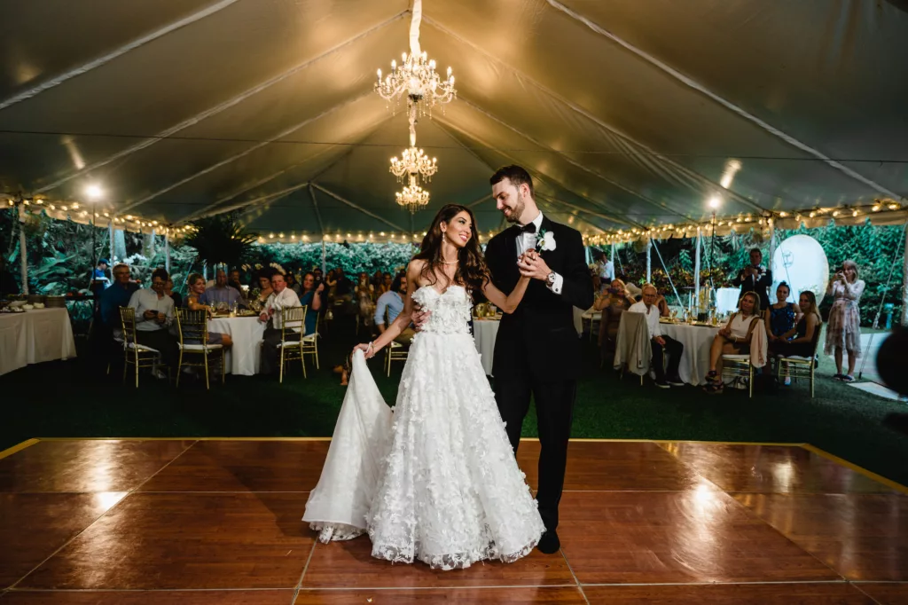 Classic Outdoor Tented Wedding Reception Inspiration | Bride and Groom Choreographed Dance Ideas | White Strapless A-Line Floral Applique Wedding Dress | St. Pete Event Venue Sunken Gardens | Tampa Bay Caterer Olympia Catering | Photographer and Videographer Iyrus Weddings