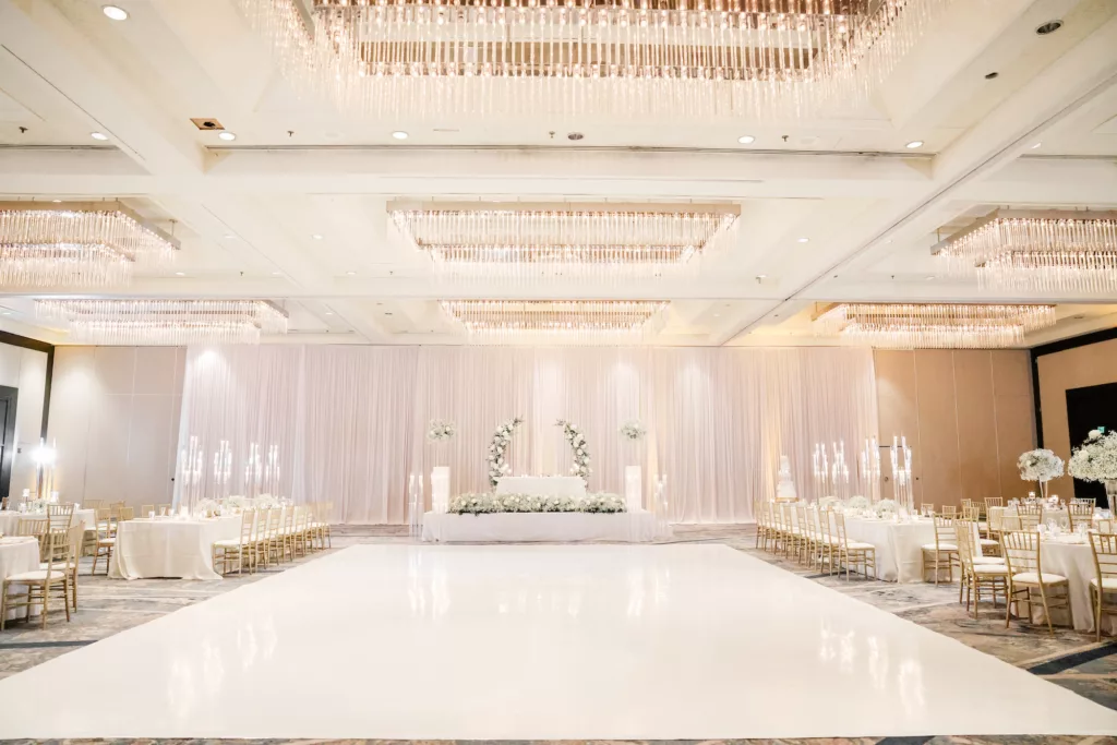 Extravagant Ivory, White, and Gold Wedding Reception Large White Dance Floor Inspiration | Tampa Bay Event Venue Hilton Tampa Downtown | Planner Special Moments Event Planning