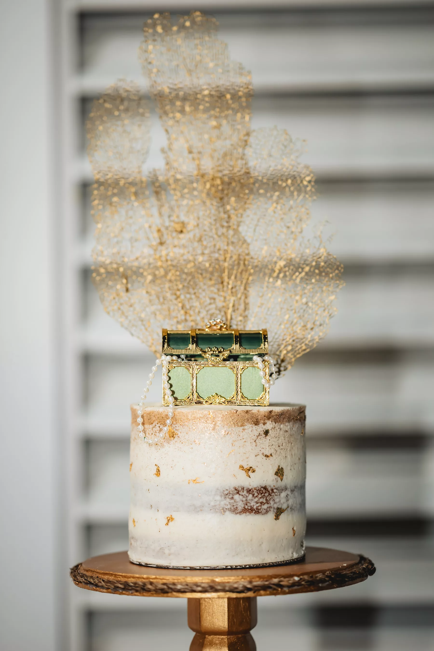 Nautical Inspired Single Tier Round Naked Wedding Cake with Treasure Chest Cake Topper and Gold Coral