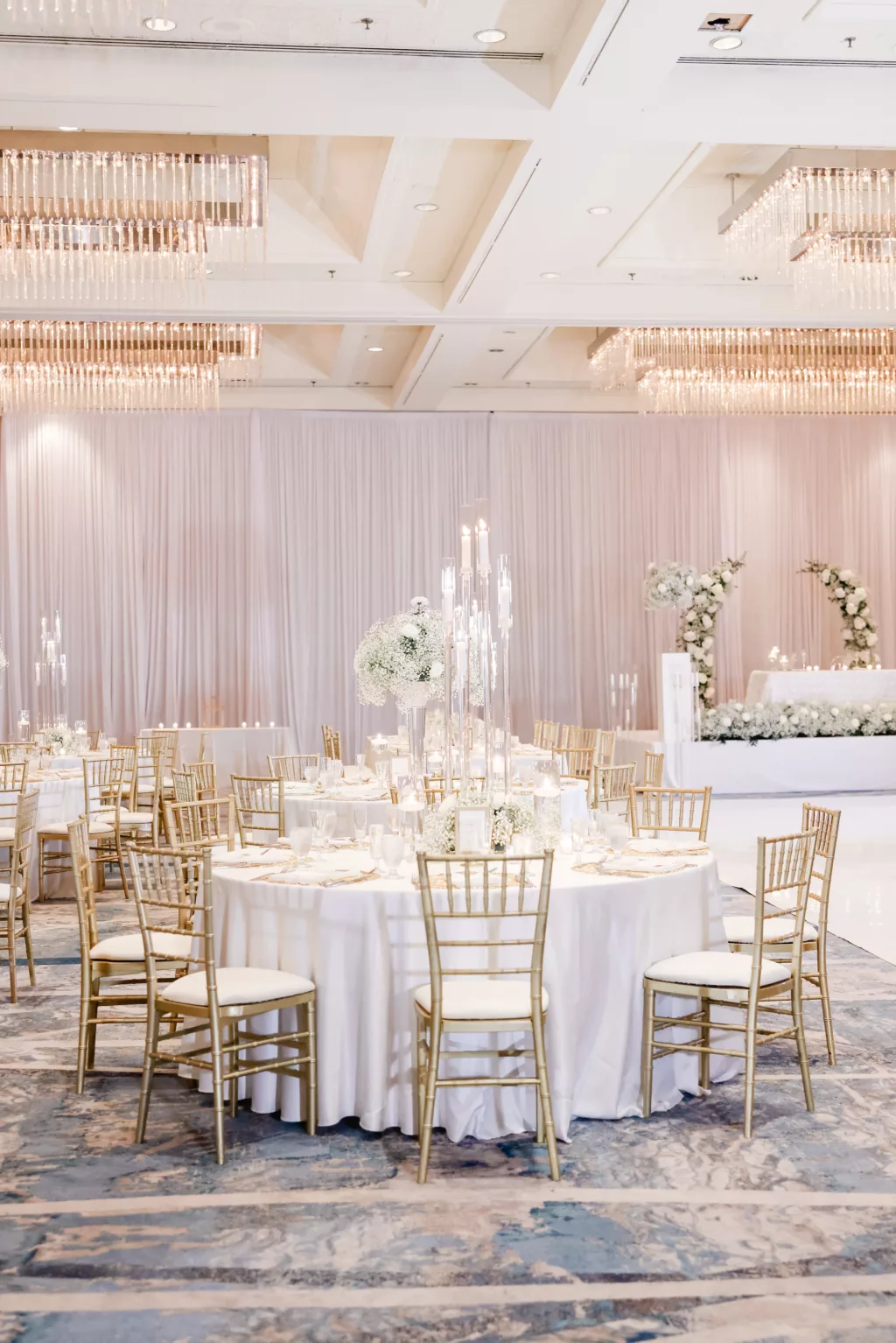 Extravagant Ivory, White, and Gold Wedding Reception Decor Inspiration | Tall Modern Acrylic Candelabra Centerpiece Ideas | Gold Chiavari Chairs | Baby's Breath and White Chrysanthemum Floral Arrangement Centerpieces | Tampa Bay Hotel Venue Hilton Tampa Downtown | Planner Special Moments Event Planning
