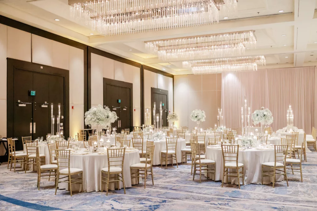 Extravagant Ivory, White, and Gold Wedding Reception Decor Inspiration | Tall Modern Acrylic Candelabra Centerpiece Ideas | Gold Chiavari Chairs | Baby's Breath and White Chrysanthemum Floral Arrangement Centerpieces | Tampa Wedding Planner Special Moments Event Planning