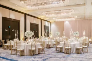 Extravagant Ivory, White, and Gold Wedding Reception Decor Inspiration | Tall Modern Acrylic Candelabra Centerpiece Ideas | Gold Chiavari Chairs | Baby's Breath and White Chrysanthemum Floral Arrangement Centerpieces | Tampa Wedding Planner Special Moments Event Planning