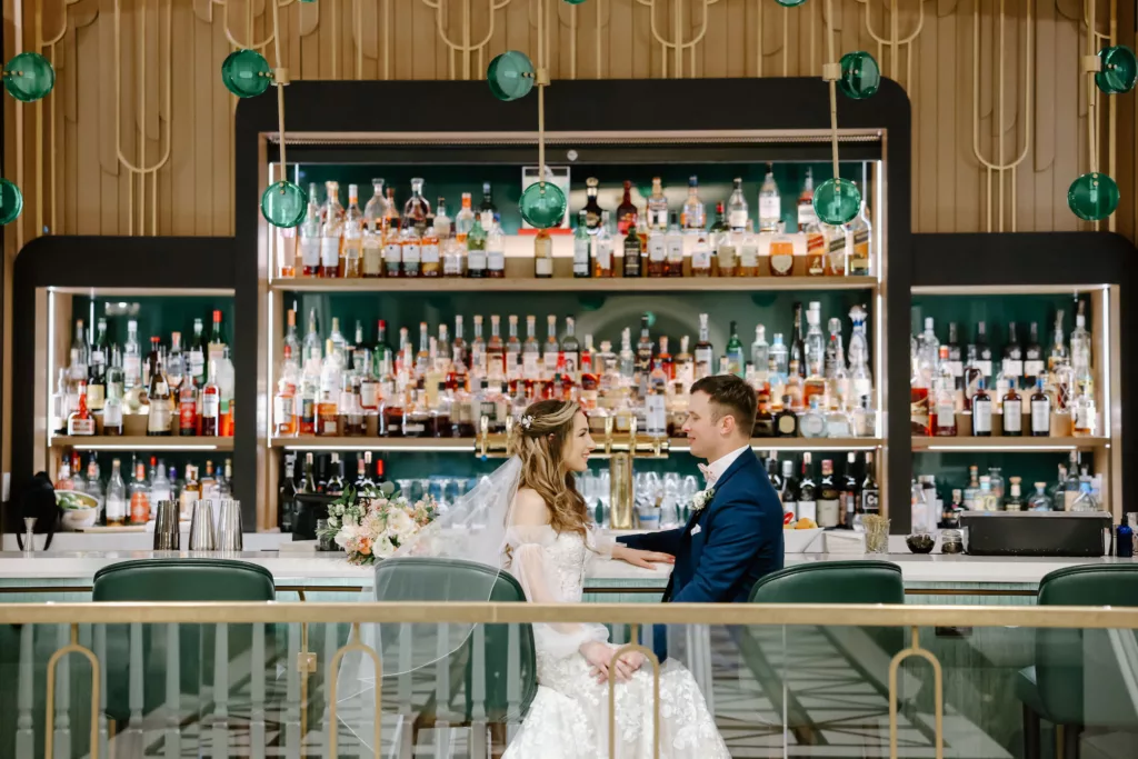 Bride and Groom Enjoying Drink at the Bar Wedding Portrait | Tampa Bay Event Venue The Don Cesar