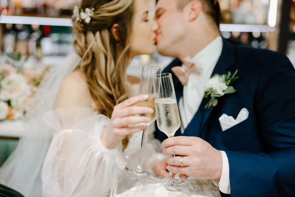 Bride and Groom Celebrate Wedding Day with Champagne Toast Portrait