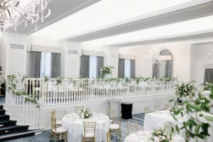 White and Gold Grand Ballroom Wedding Reception | Greenery Garland Banister Decor Inspiration | Tampa Bay Event Venue The Don Cesar