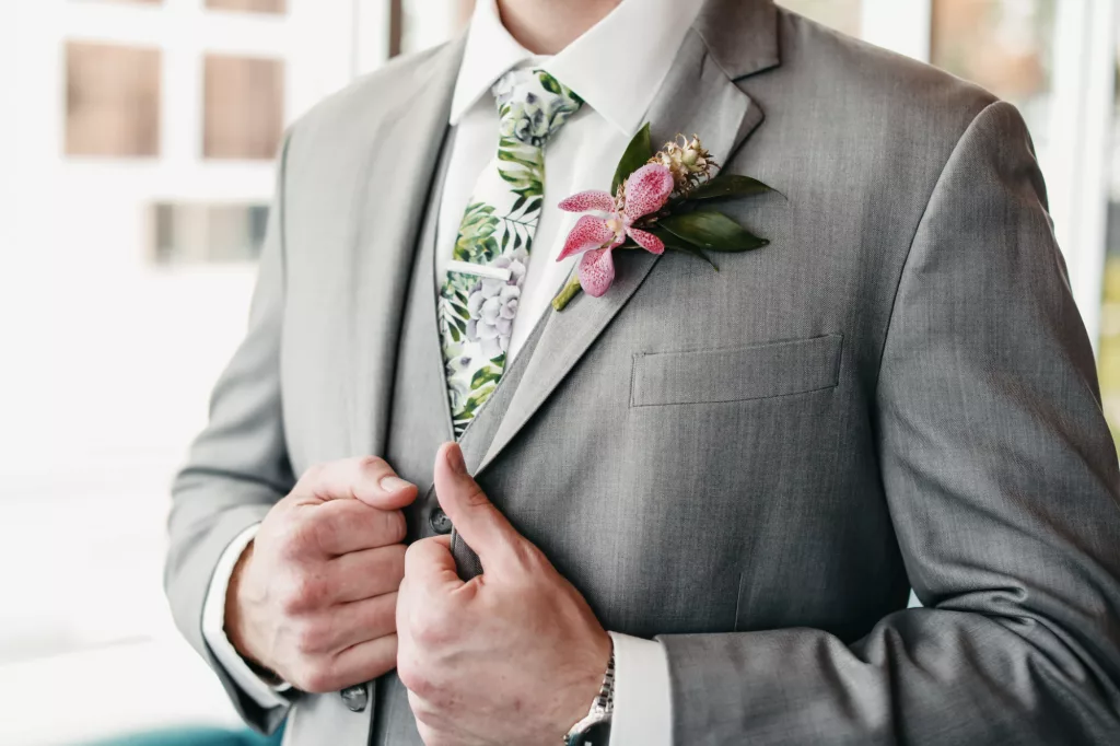 Groom's Gray Three Piece Suit with Tropical Tie Inspiration | Pink Bougainvillea and Greenery Boutonniere Ideas | Tampa Bay Florist Save The Date Florida