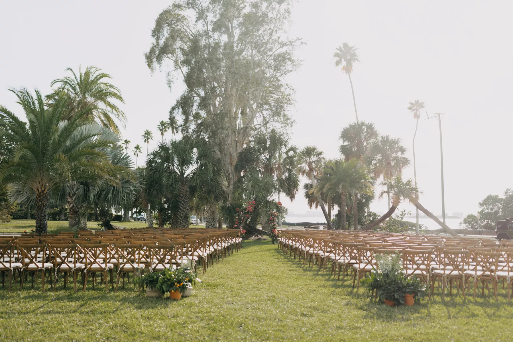 Old Florida Outdoor Wedding Ceremony Decor Ideas | Wooden Crossback Chairs with Cushions | Tampa Bay Photographer Amber McWhorter Photography | Dunedin Venue The Fenway