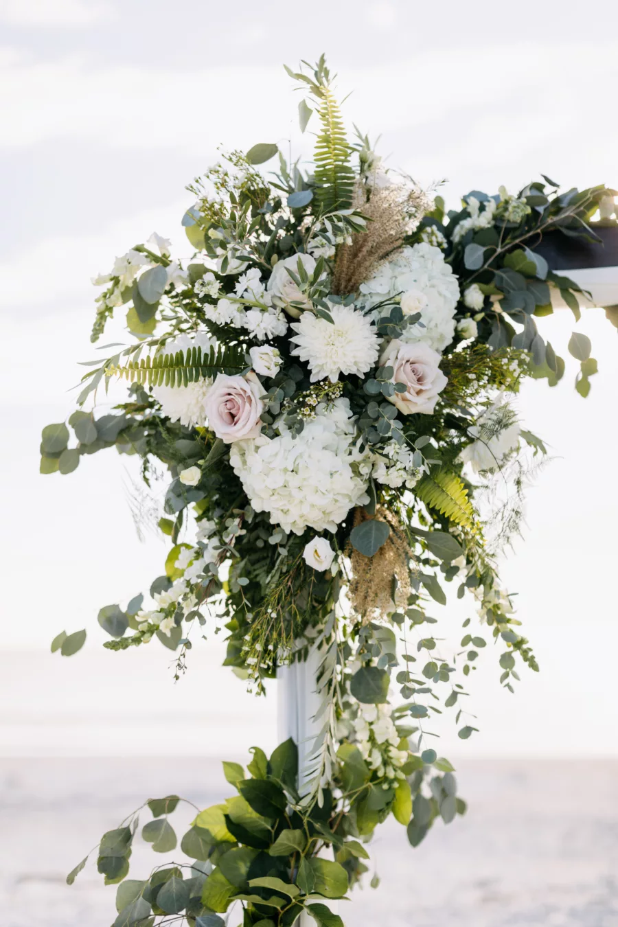 White Hydrangeas, Roses, Chrysanthemums, Fern, and Greenery Fall Boho Beach Wedding Ceremony Arbor Flower Arrangement Inspiration