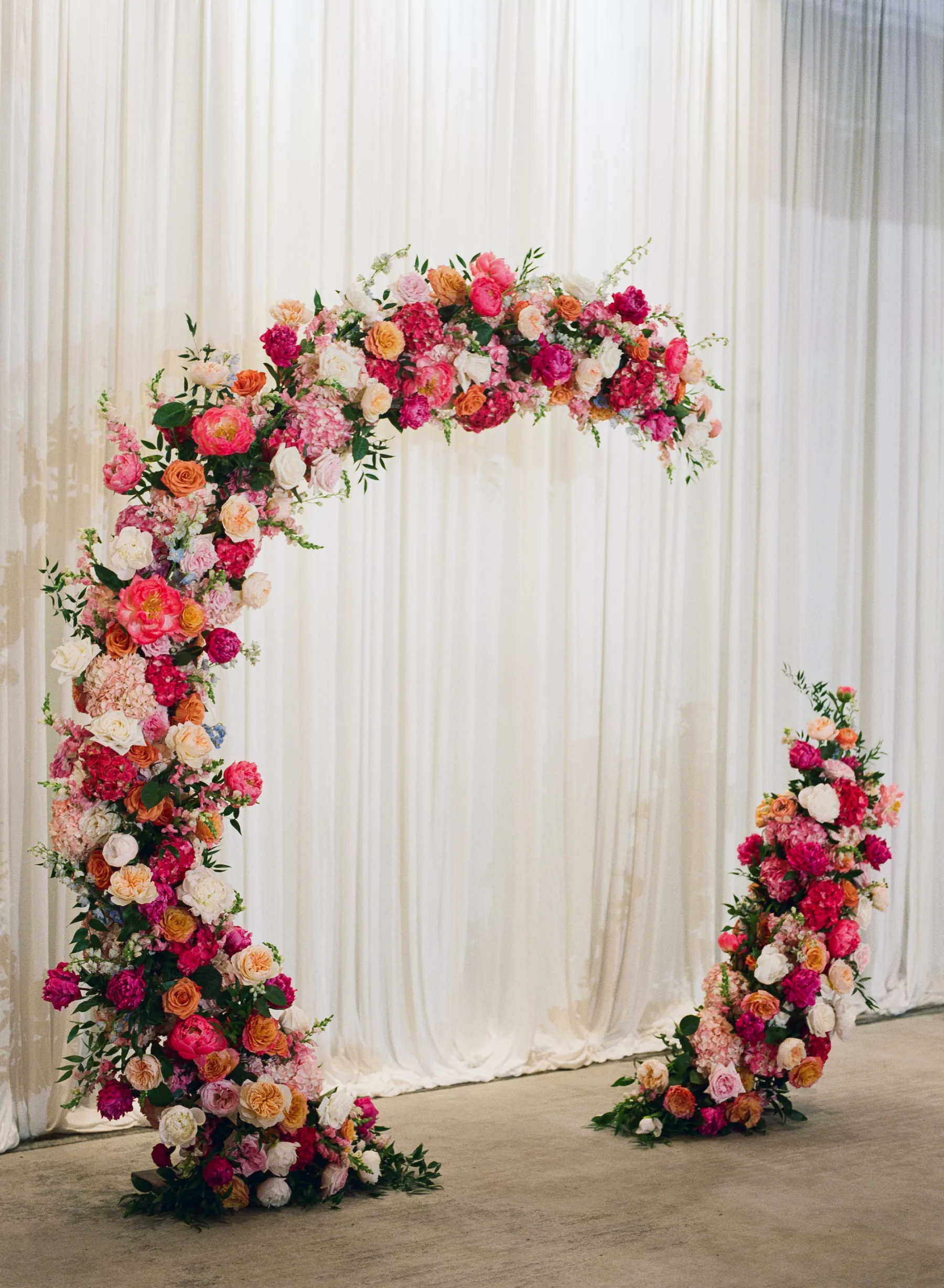 Round Wedding Ceremony Arch Inspiration with Pink Hydrangeas and Orange Garden Roses | Tampa Bay Florist Bruce Wayne Florals
