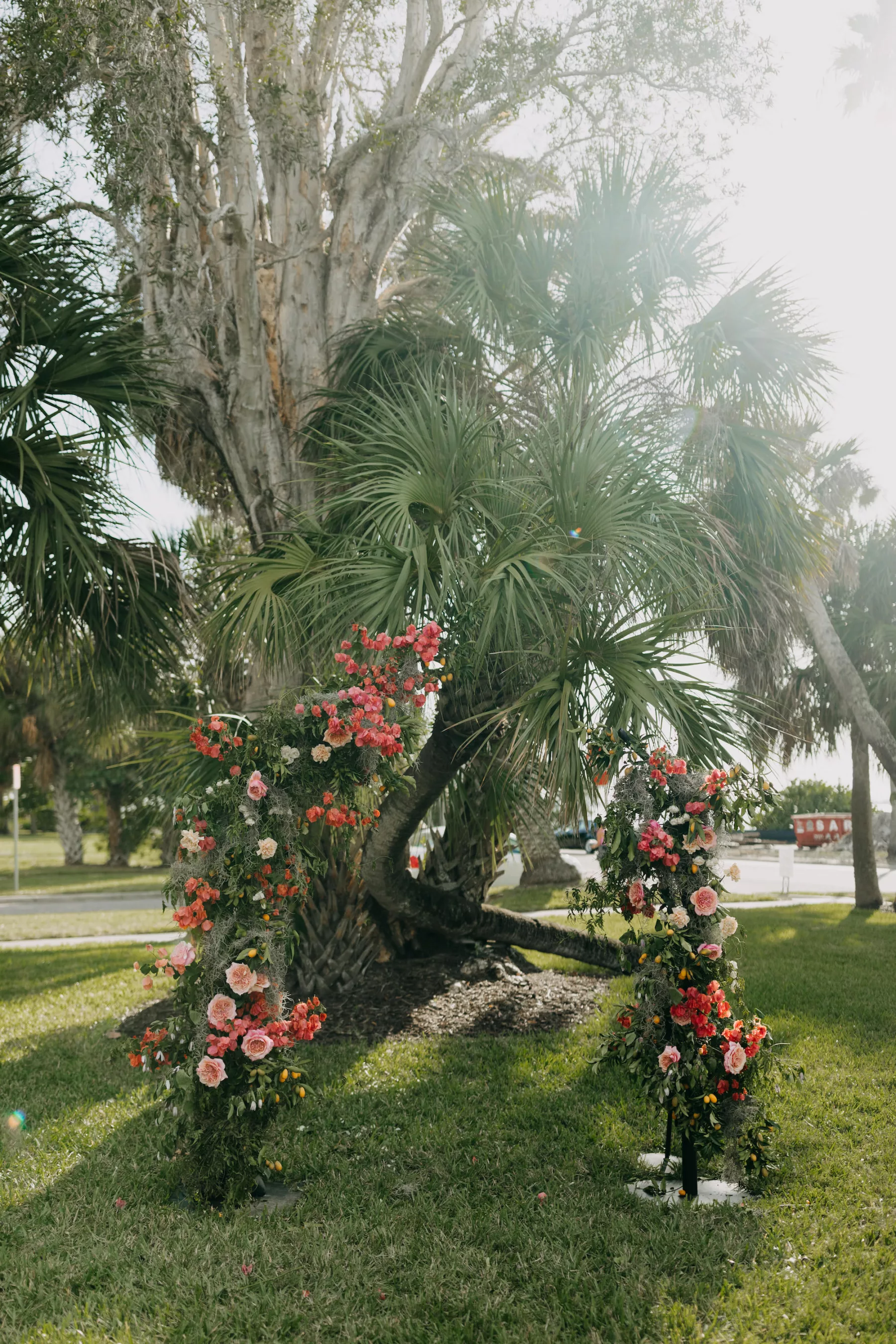 Old Florida Inspired Flower Arch Decor Ideas | Pink Bougainvillea, Garden Roses, White Carnations, and Greenery | Dunedin Venue The Fenway