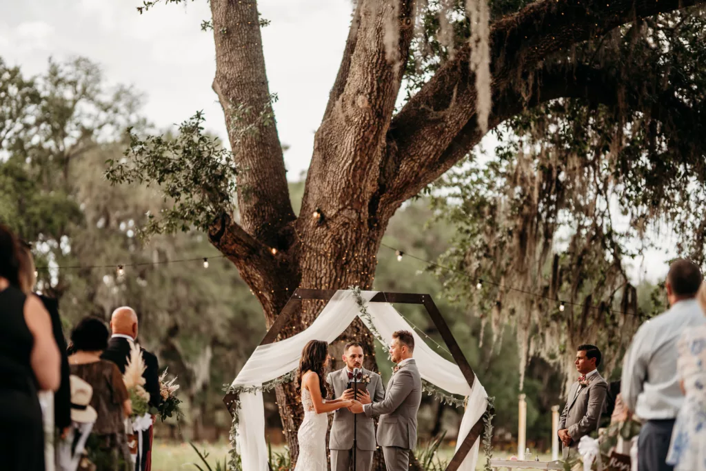 Outdoor Boho Wedding Ceremony with Hexagon Arch with White Drapery Decor Ideas | Tampa Wedding Photographer and Videographer Sabrina Autumn Photography