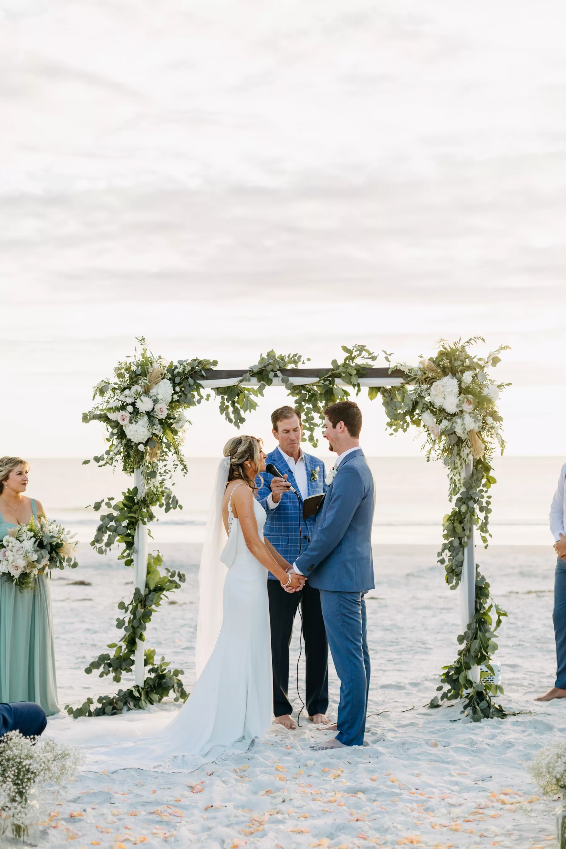 White Arbor with Wrapped Greenery Garland and White Roses for Fall Boho Beach Wedding Decor Ideas
