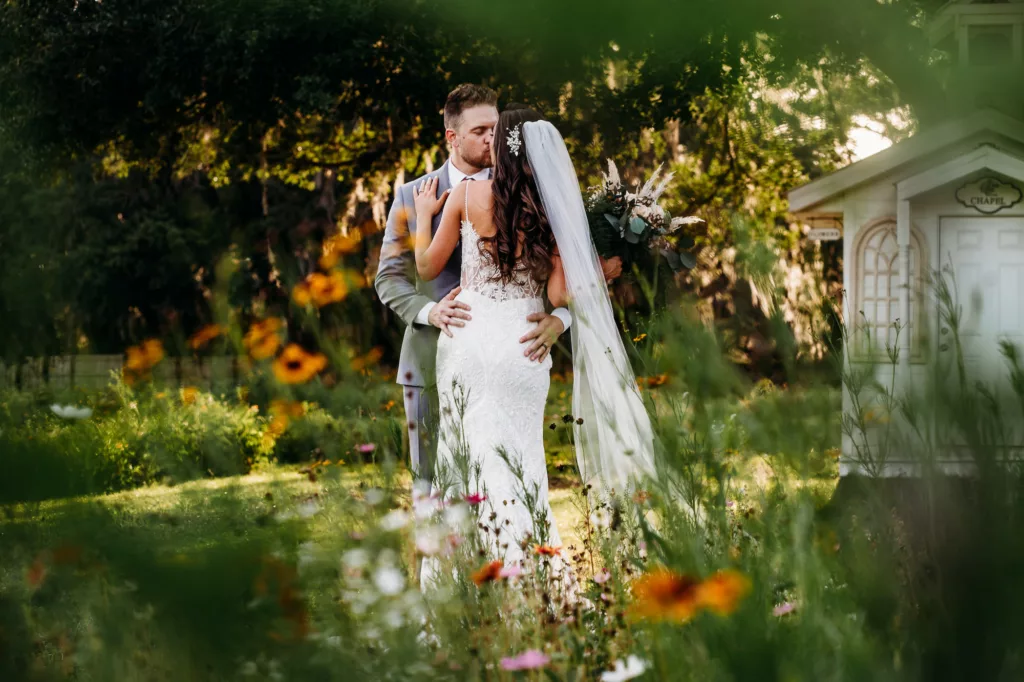 Bride and Groom Walking Through Wildflower Garden Wedding Portrait | Tampa Bay Photographer Summer Autumn Photography