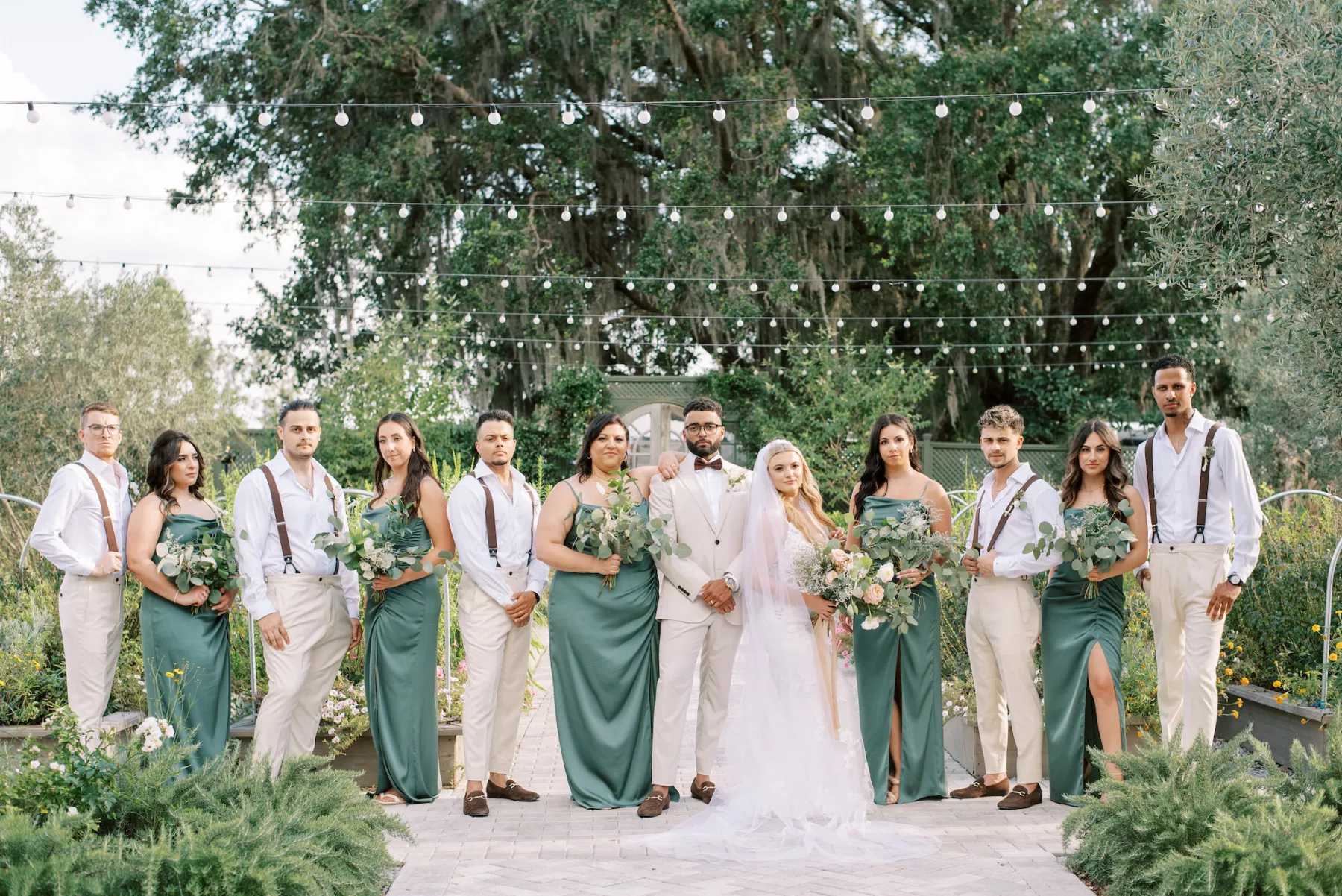 Matching Green Satin Bridesmaids Dresses | Tan Dress Pants With Suspenders Wedding Party Attire Inspiration