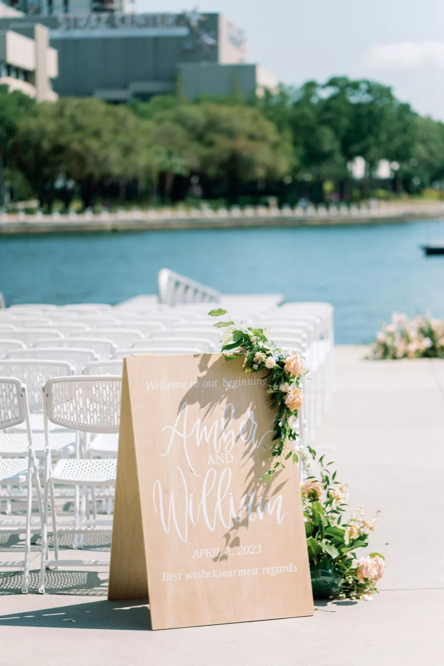 Sandwich Board Wedding Ceremony Sign Decor Inspiration with Pink and Orange Roses, and Greenery