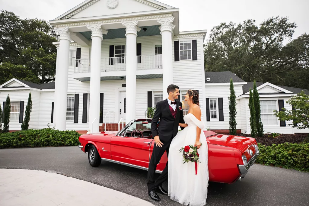 Bride and Groom with Classic Convertible Getaway Car | Tampa Bay Wedding Venue Legacy Lane Weddings | Brooksville Photographer Limelight Photography
