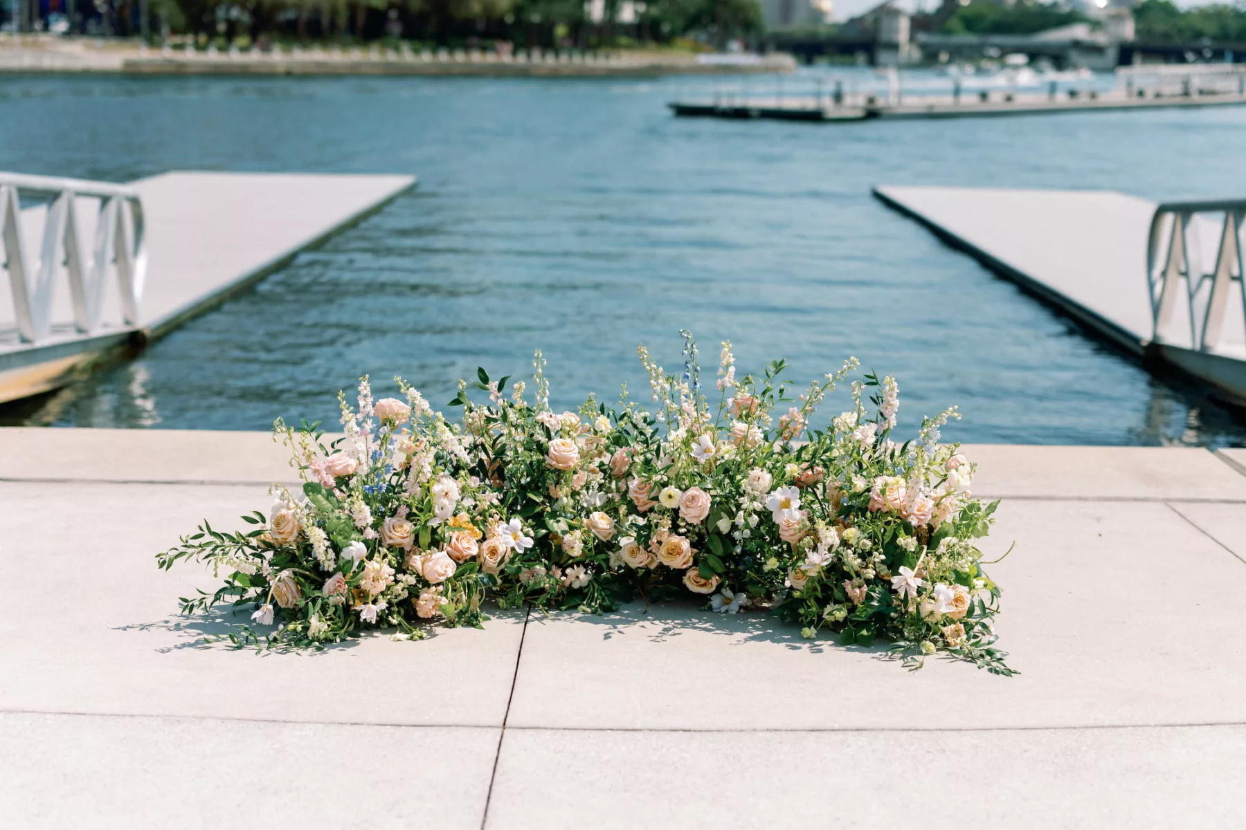 Elegant Outdoor Waterfront Pastel Wedding Ceremony Inspiration | Altar Floral Decor Ideas with Pink Roses, White Poppy, Blue and White Campanula, and Greenery