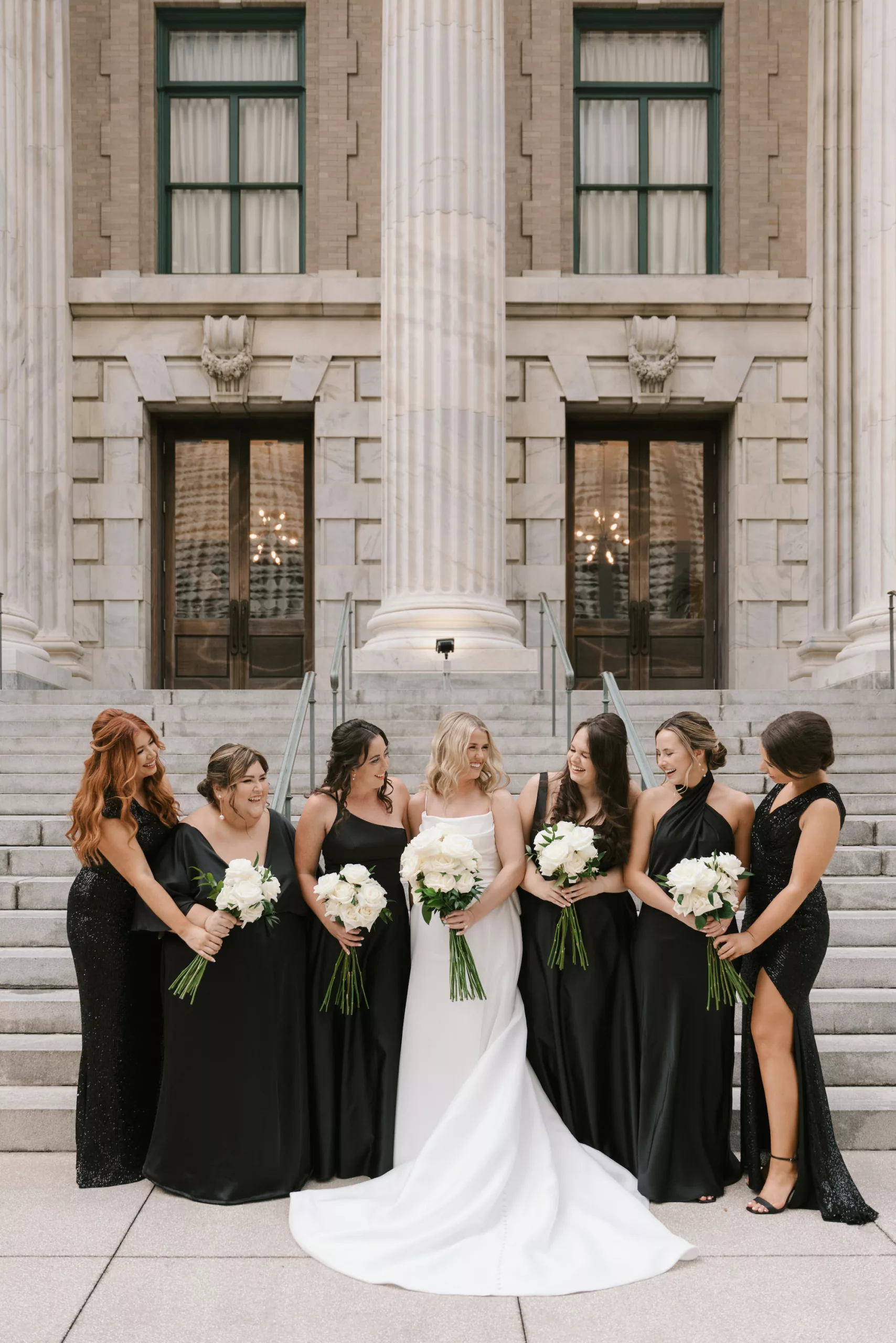 Mimatched Black Bridesmaid Wedding Dress Ideas | Long Stem White Rose Bouquet Inspiration | Downtown Tampa Venue Le Meridien
