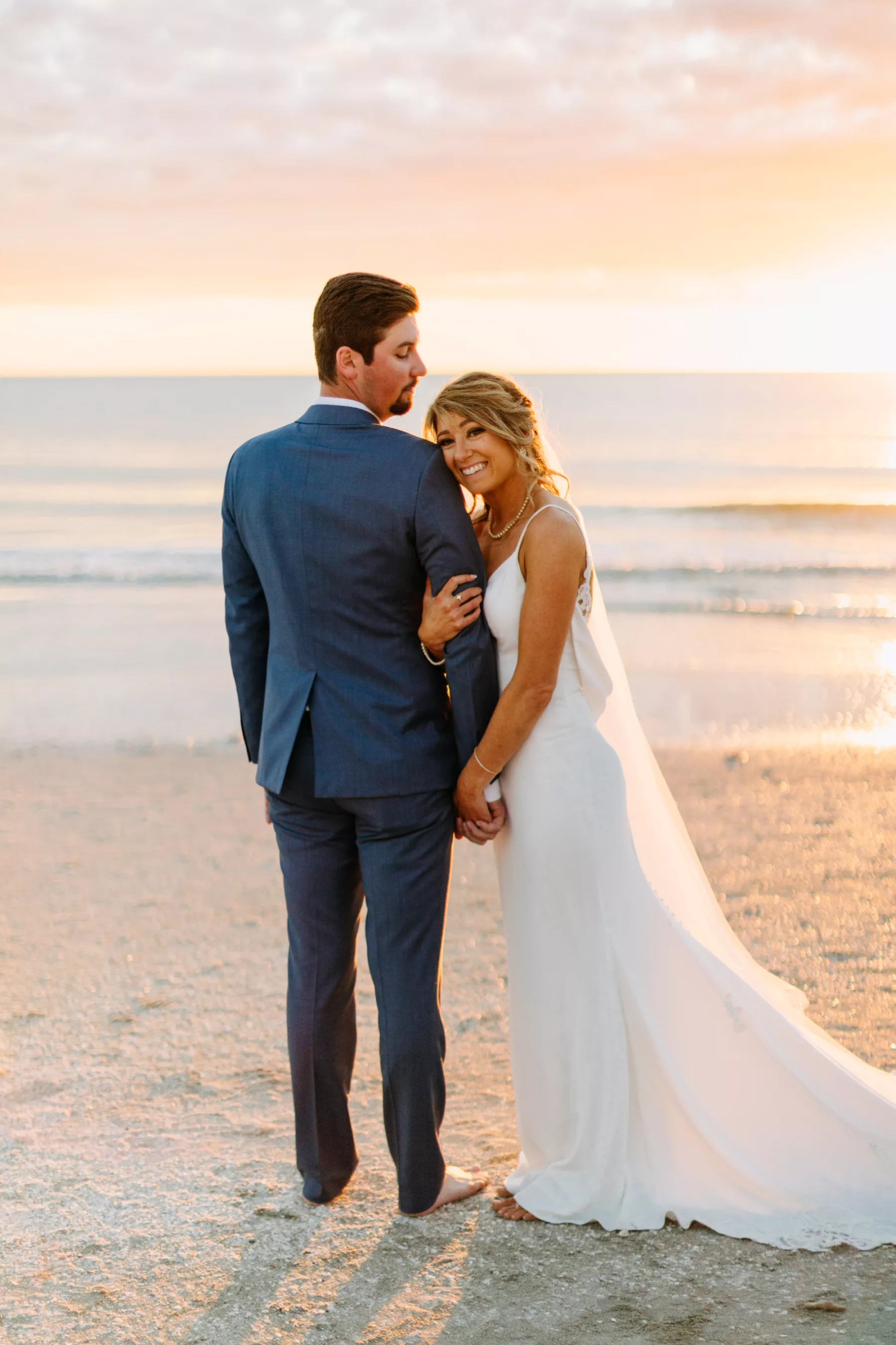 Romantic Bride and Groom Sunset Beach Wedding Portrait | Tampa Bay Photographer Amber McWhorter Photography | Maderia Beach Videographer Priceless Studio Design