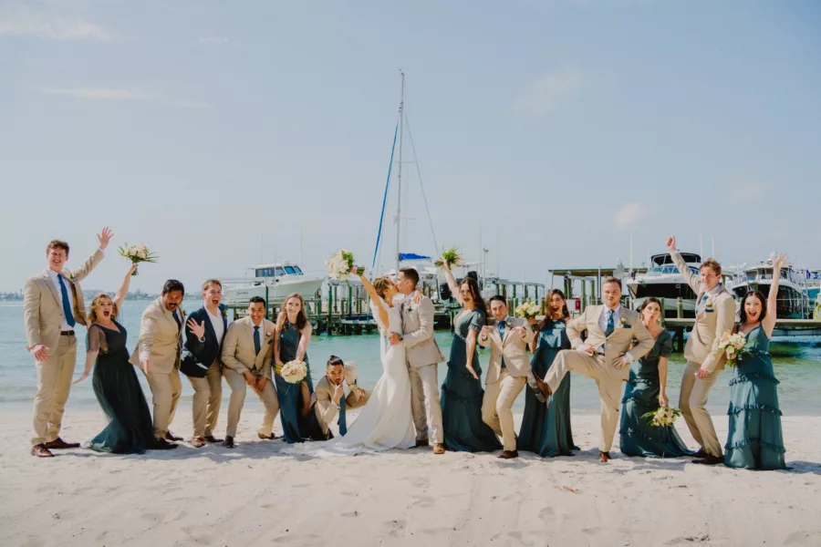 Khaki Suits and Mismatched Eucalyptus Green Bridesmaids Dress Wedding Party Attire Inspiration | Waterfront St Pete Venue Isla Del Sol Yacht and Country Club