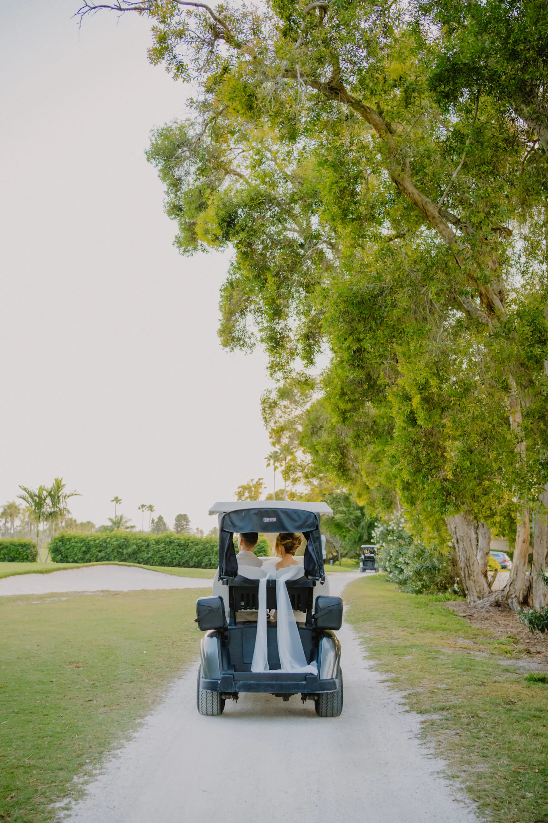 Bride and Groom Golf Cart Wedding Portrait