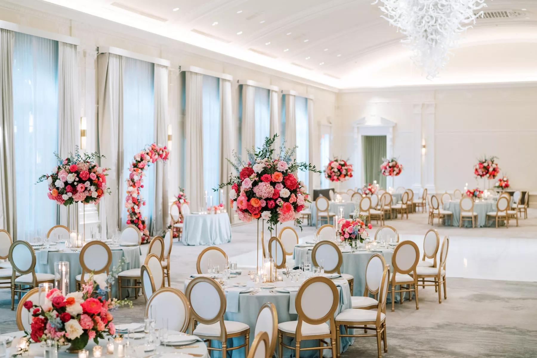 Luxurious Pink and Blue Summer Ballroom Wedding Reception Decor Ideas | Tall Flower Stand with Pink Anemones and Hydrangeas, Orange Garden Roses, Blue Stock Flowers | Elegant Gold and White Chairs | Tampa Bay Florist Bruce Wayne Florals | Kate Ryan Event Rentals | Planner Parties A La Carte | Venue The Vinoy 