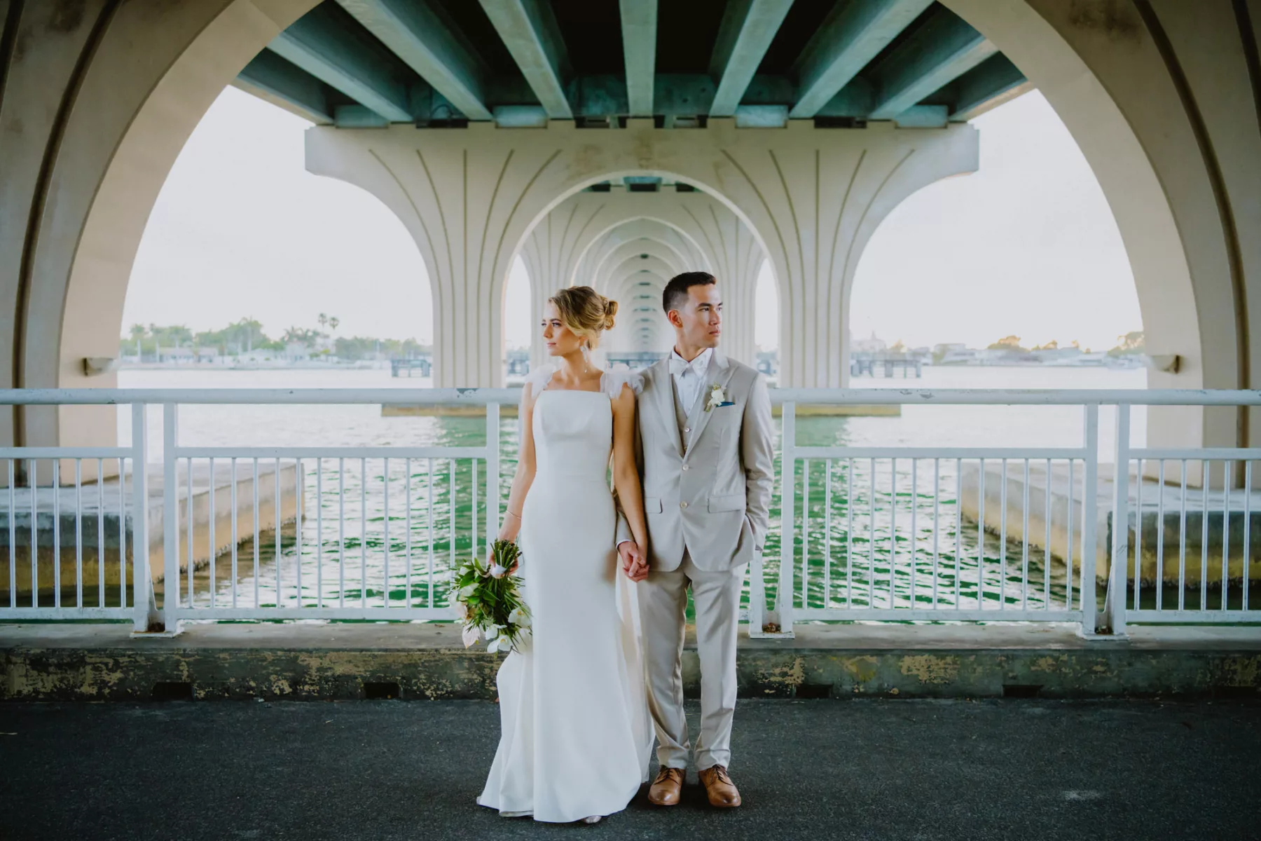 Classic White Satin Fit and Flare Justin Alexander Wedding Dress with Tulle Cape Veil Inspiration | Khaki Three Piece Groom Suit Attire Ideas | St Pete Photographer and Videographer Mars and the Moon Films