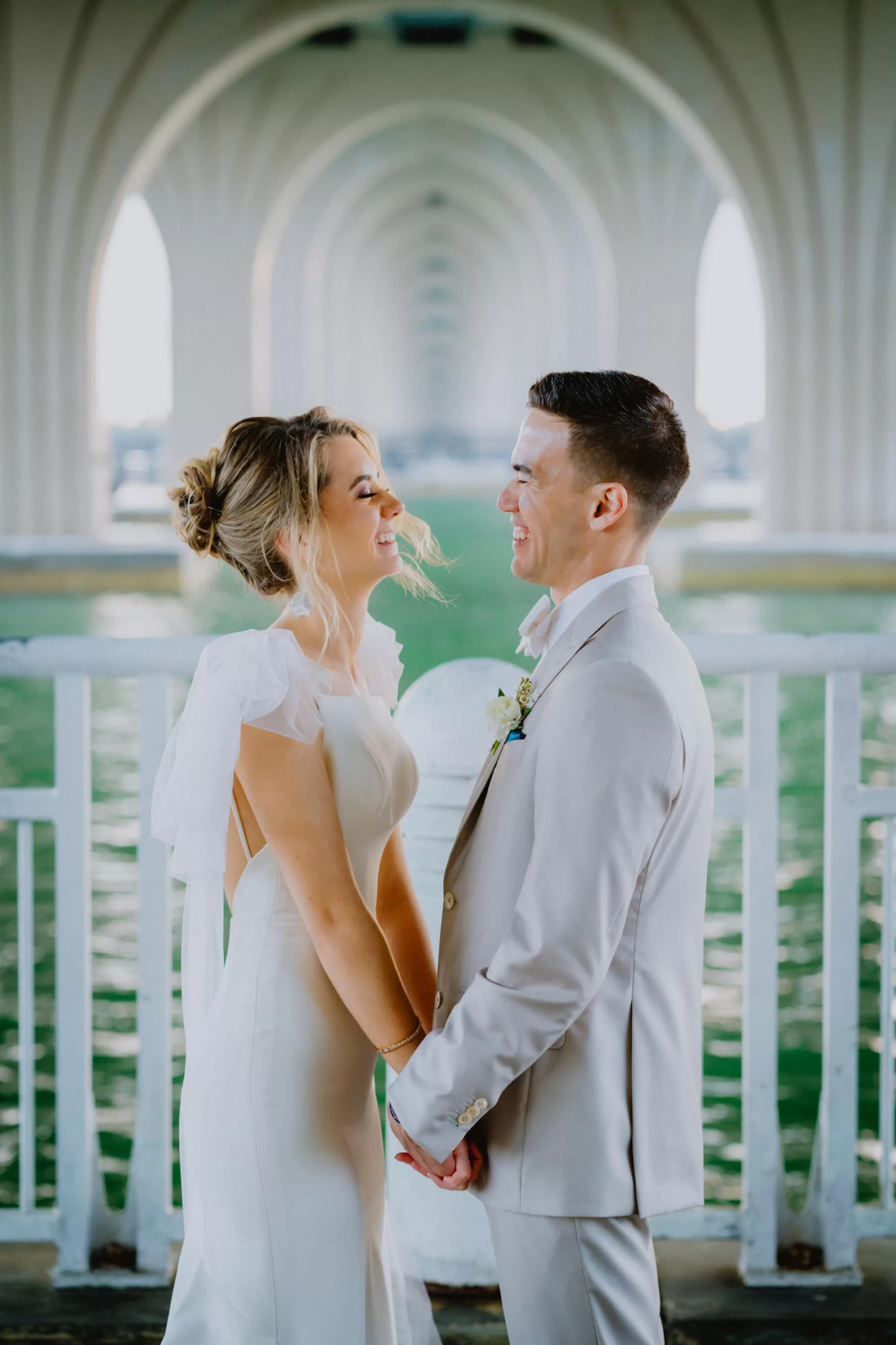Bride and Groom Under St Petersburg Bridge Wedding Portrait | St Pete Photographer and Videographer Mars and the Moon Films