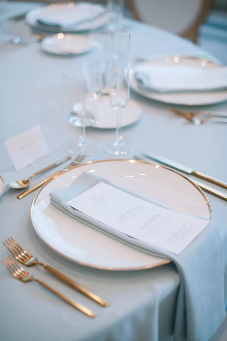 Luxurious Blue Wedding Reception Tablescape Place Setting with Gold Flatware Inspiration