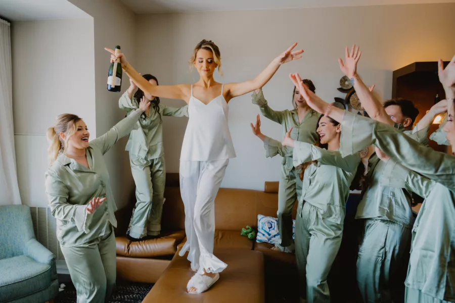 Bride and Bridesmaids Wedding Day Champagne Celebration | Matching Green Satin Pajamas Inspiration