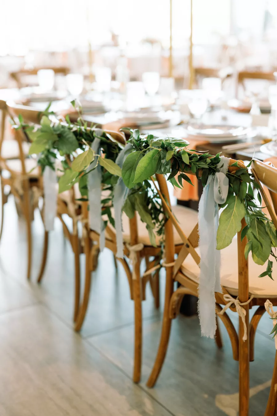 Wooden Crossback Chairs with Greenery Decor for Romantic Spring Pastel Wedding Reception