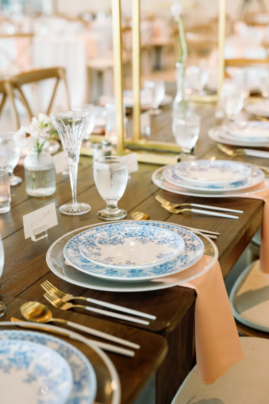 Romantic Spring Pastel Pink and Blue Wedding Reception Decor Ideas | Blue Floral China with White and Gold Flatware | Rustic Wooden Feasting Table Inspiration | Tampa Bay Planner Wilder Mind Events
