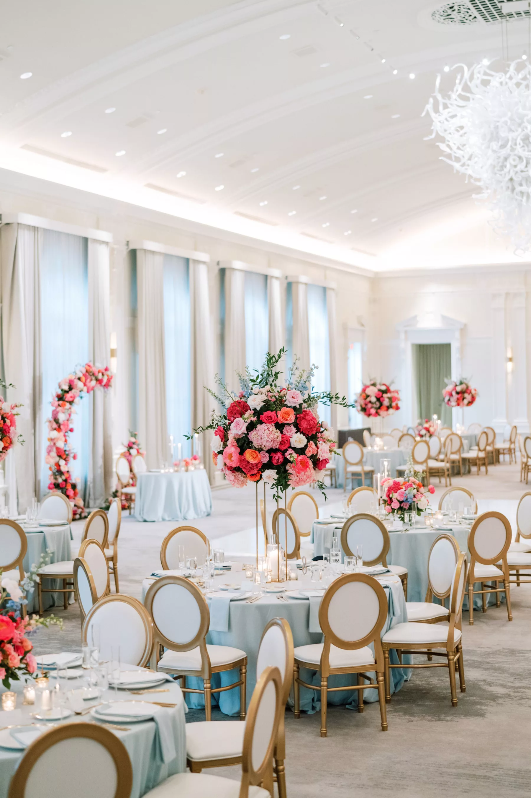 Luxurious Pink and Blue Summer Ballroom Wedding Reception Decor Ideas | Tall Flower Stand with Pink Anemones and Hydrangeas, Orange Garden Roses, Blue Stock Flowers | Elegant Gold and White Chairs | Tampa Bay Florist Bruce Wayne Florals | Kate Ryan Event Rentals | Planner Parties A La Carte | Venue The Vinoy 