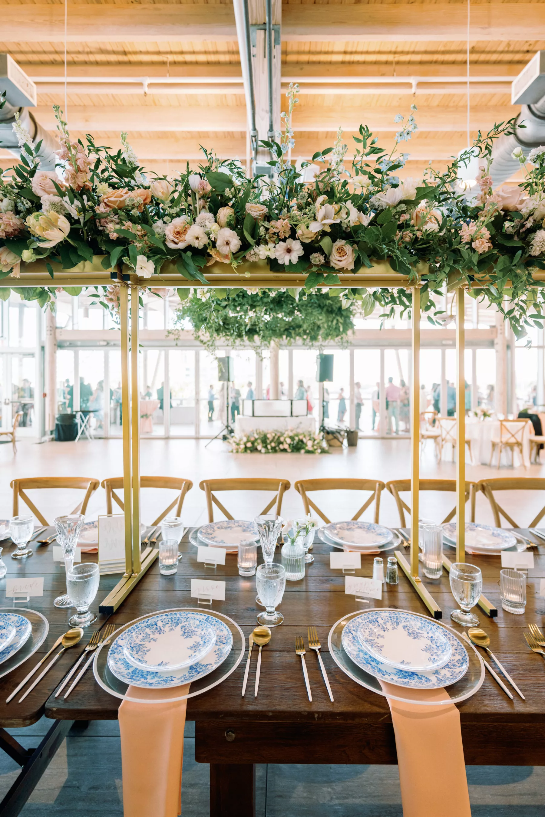 Romantic Pastel Pink and Blue Wedding Reception Tablescape Inspiration | Tall Gold Flower Stand Centerpiece Decor Ideas with White Anemone, Pink Roses, Stock Flowers, and Greenery | Tampa Bay Planner Wilder Mind Events | Venue Tampa River Center