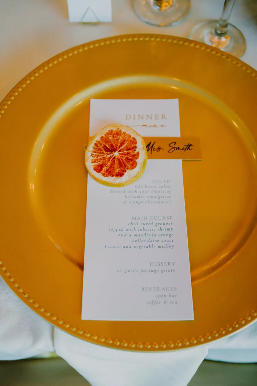 Dried Grapefruit Place Card, Menu Card, and Gold Charger Tablescape Ideas for Tropical Spring Wedding