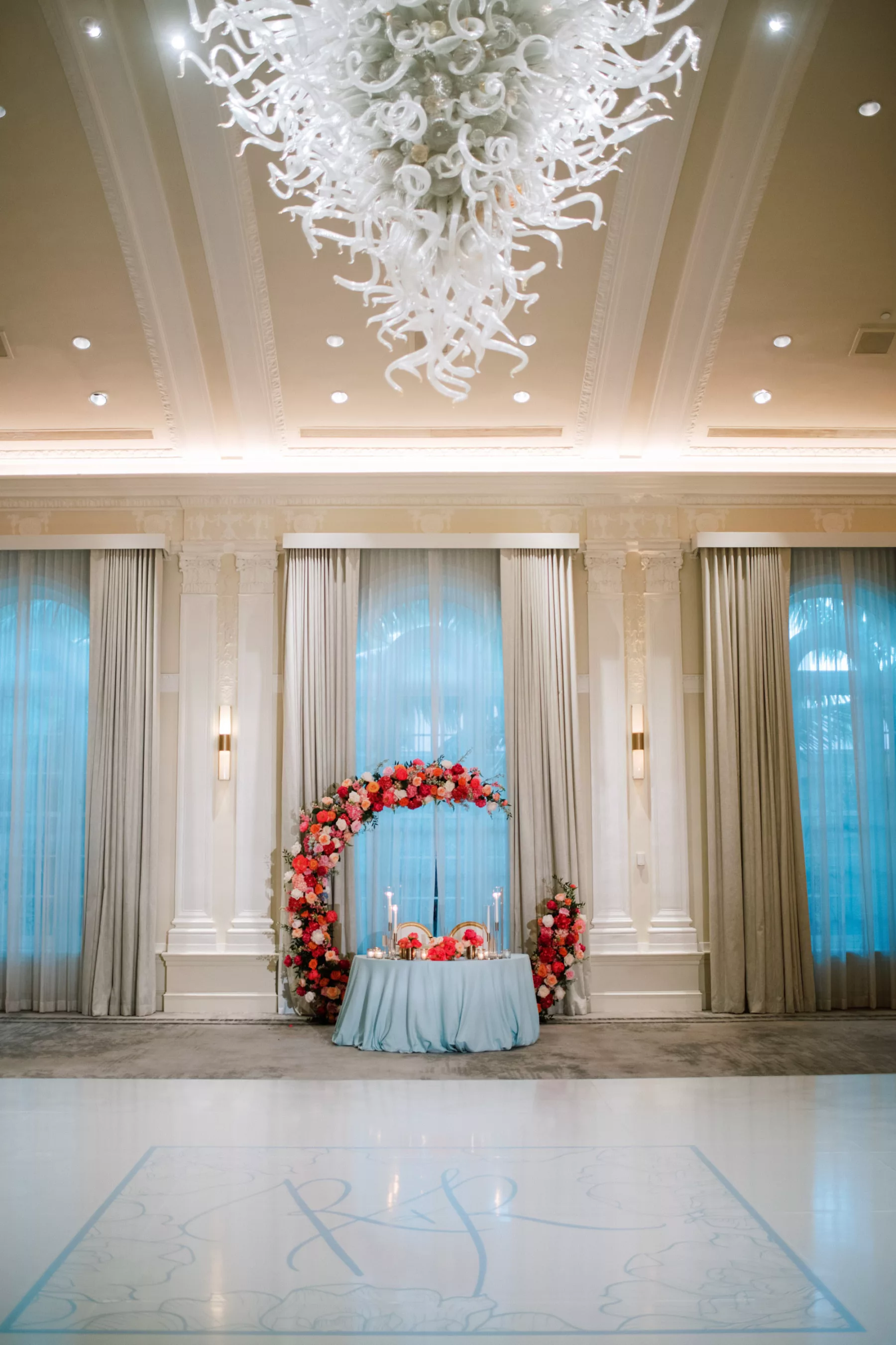 Luxurious Pink and Blue Summer Ballroom Wedding Reception Sweetheart Table Decor Ideas | Round Backdrop with Pink Hydrangeas and Orange Garden Roses | Tampa Bay Florist Bruce Wayne Florals | Event Planner Parties A La Carte | Kate Ryan Event Rentals | Venue The Vinoy