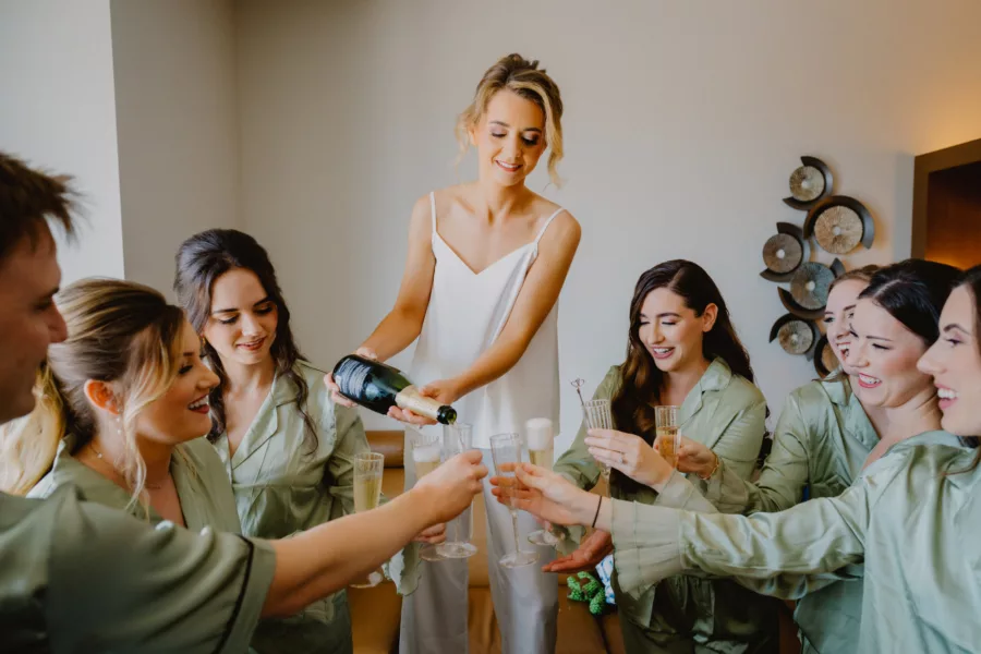 Bride and Bridesmaids Wedding Day Champagne Celebration | Matching Green Satin Pajamas Inspiration